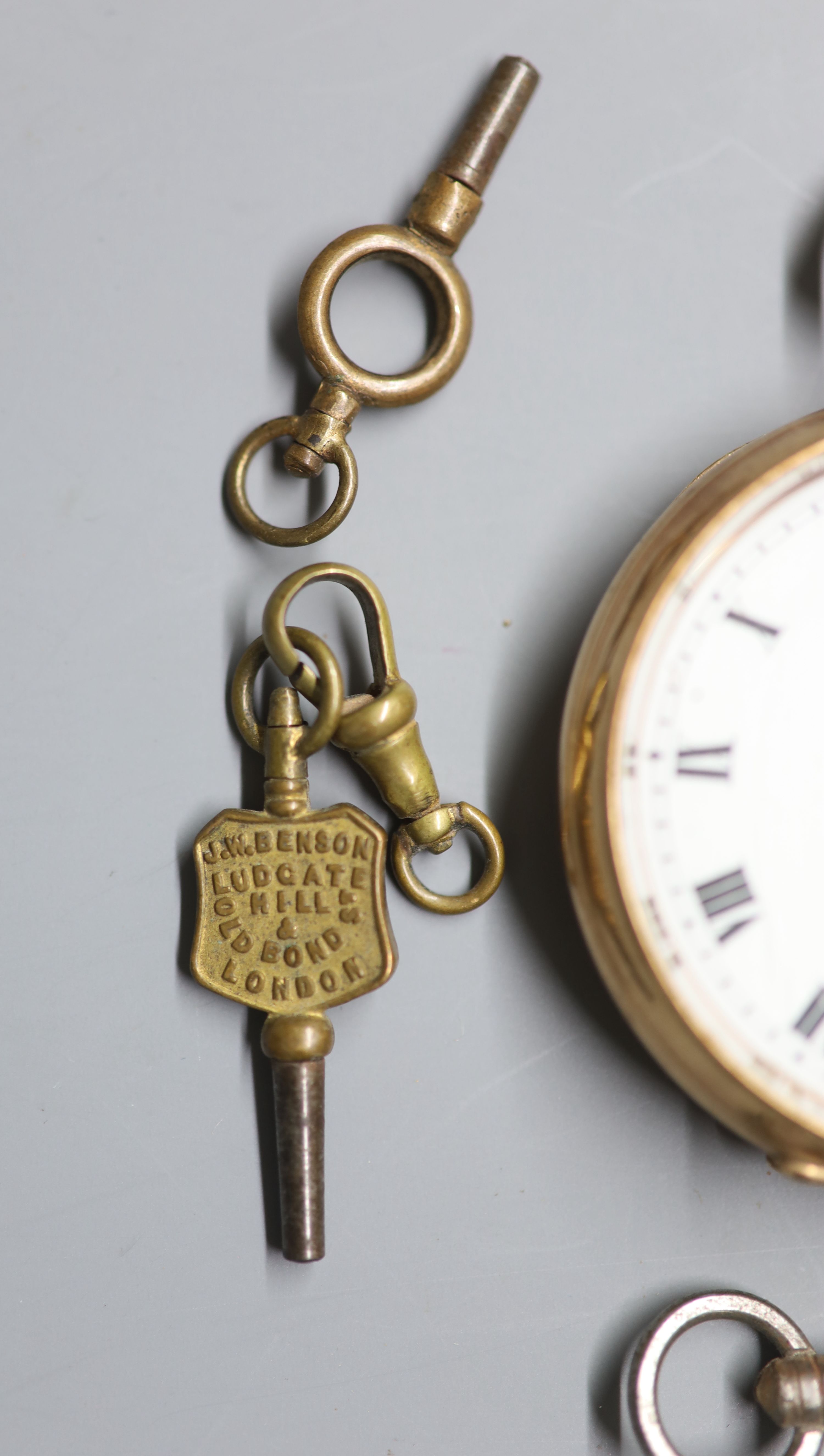 A George V 9ct gold open faced keyless lever pocket watch, retailed by Hinds Ltd, London, six watch keys and a gem set fob seal,